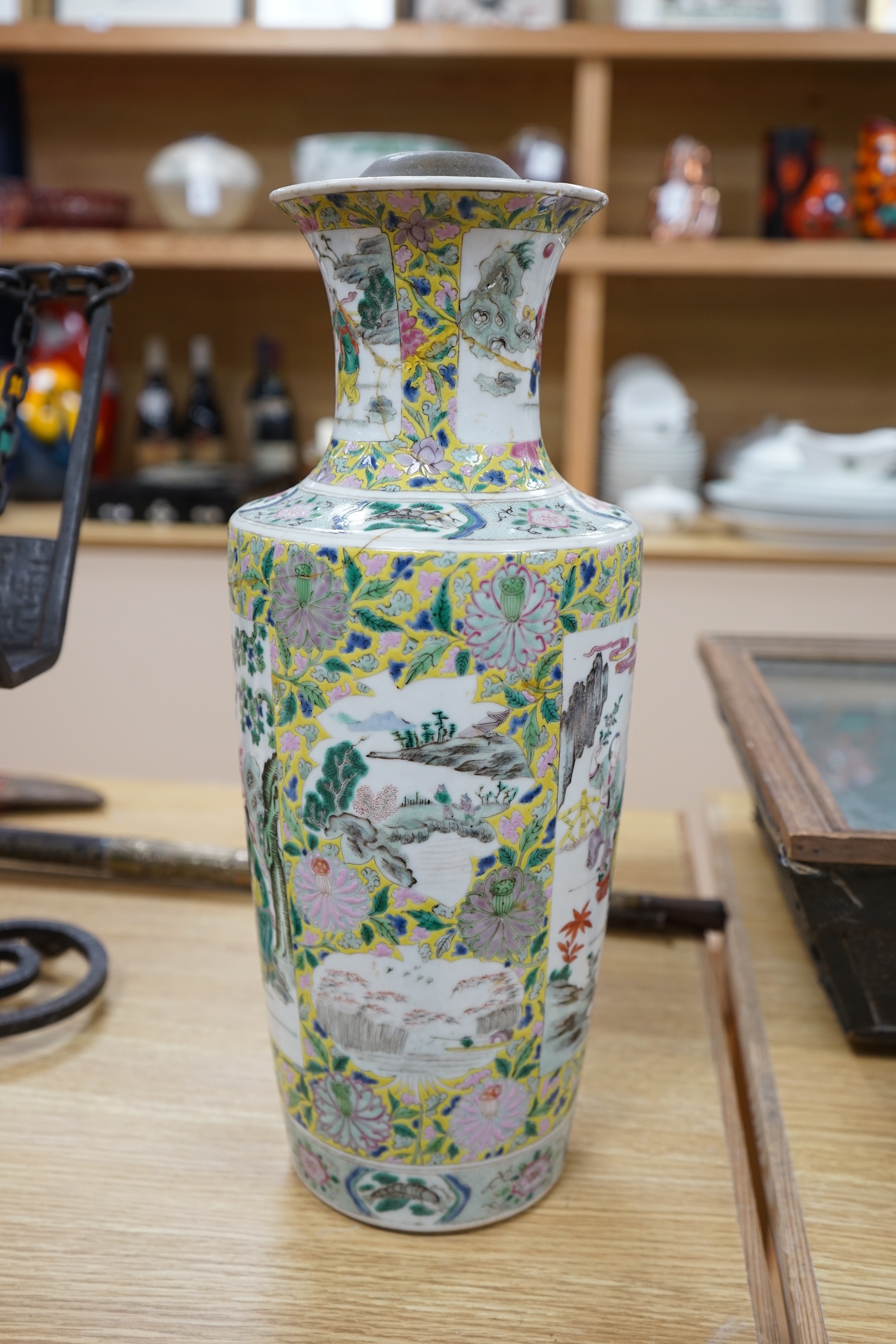 A 19th century Chinese famille rose porcelain vase enamelled with figures and flowers, converted to a lamp base, 43cm high. Condition - poor